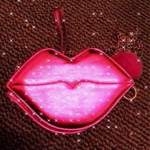 Pink Lip shaped purse .